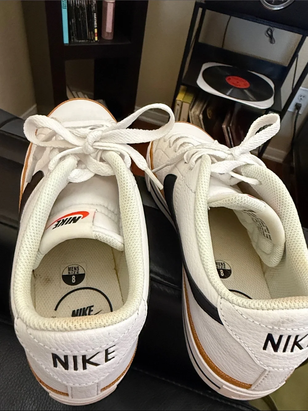 Nike White Low-Top Sneakers with Black Swoosh and Brown Trim